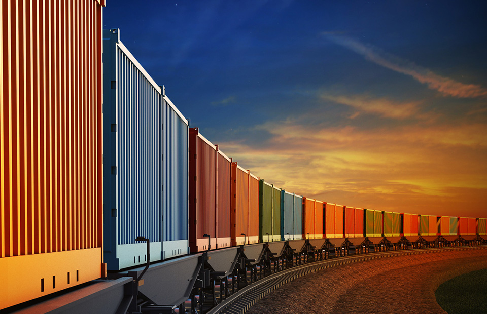 Cargo wagons in a curve in the evening light