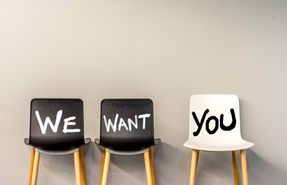 Three chairs with WE WANT YOU written on them